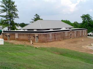 Photo of rectangular brick building.