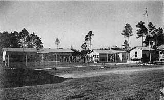 Four buildings, fenced.