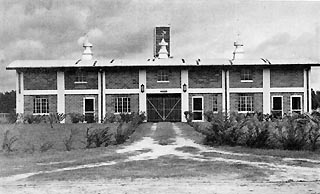 Front of long building.