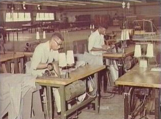 Inmates using sewing machines