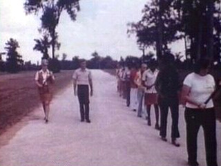 Staff Walking in the Road