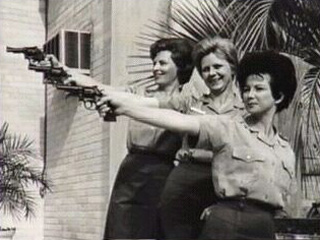 3 women holding firearms