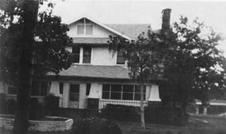 Photo of wood frame, two story house