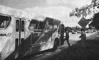 Inmates getting on a city bus