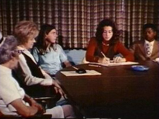 People Gathered around a desk