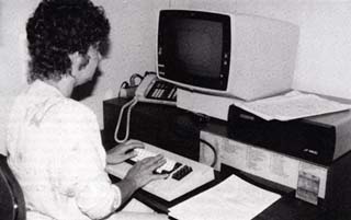 Female officer operating a terminal.