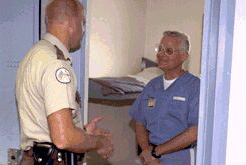 CO talking to inmate