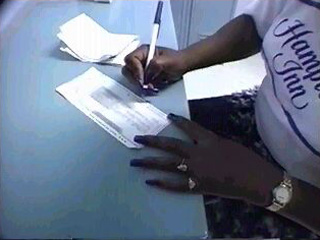 Woman Filling Out Paperwork