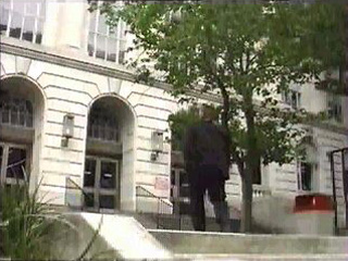 Man Walking into a building