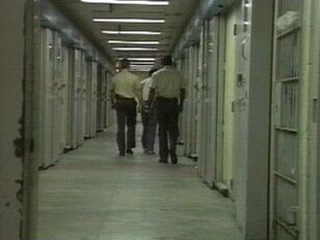 COs walking inmate to cell