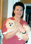 Darla Lathrem holding a small dog