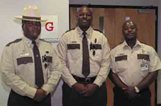 Three officers wearing old (brown) uniforms.